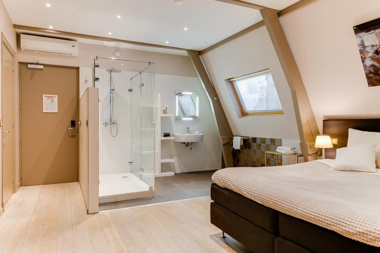 Brasss Hotel Suites Haarlem Esterno foto A room at the hotel